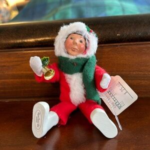 Byers Choice Ltd. Carolers little child holding bell.